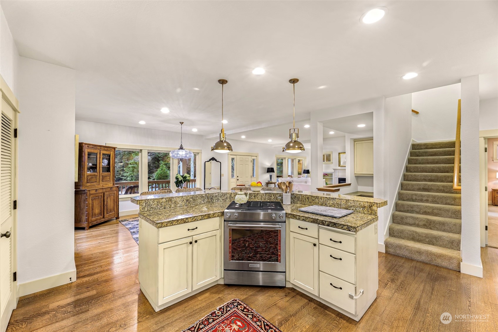 4384 Salmon Run Road Anacortes, WA 98221 - Photo 7 of 34 a kitchen with white cabinets and stainless steel appliances