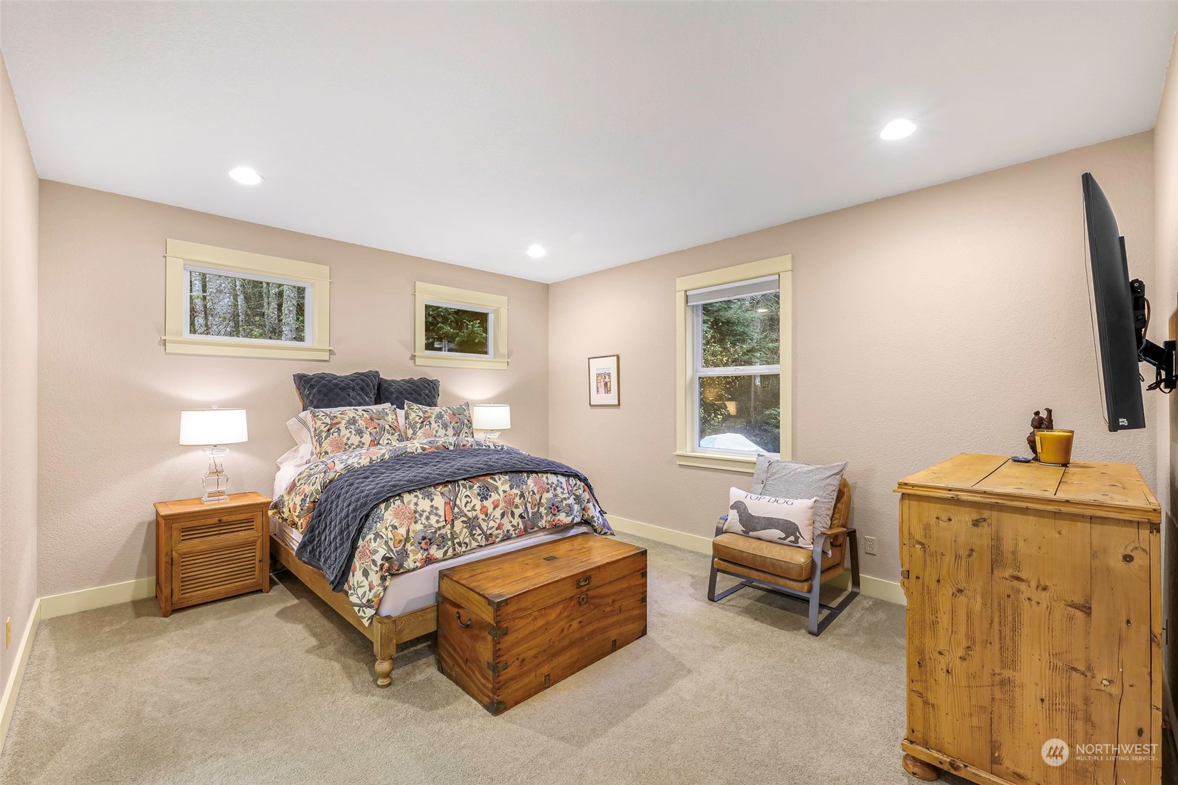 4384 Salmon Run Road Anacortes, WA 98221 - Photo 9 of 34 a bedroom with a bed and a flat screen tv