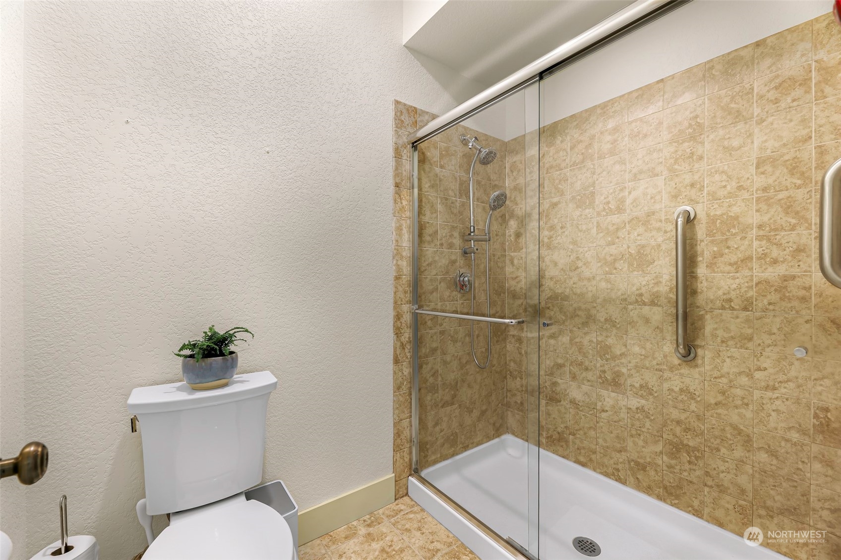 4384 Salmon Run Road Anacortes, WA 98221 - Photo 10 of 34 a bathroom with a sink a toilet and shower