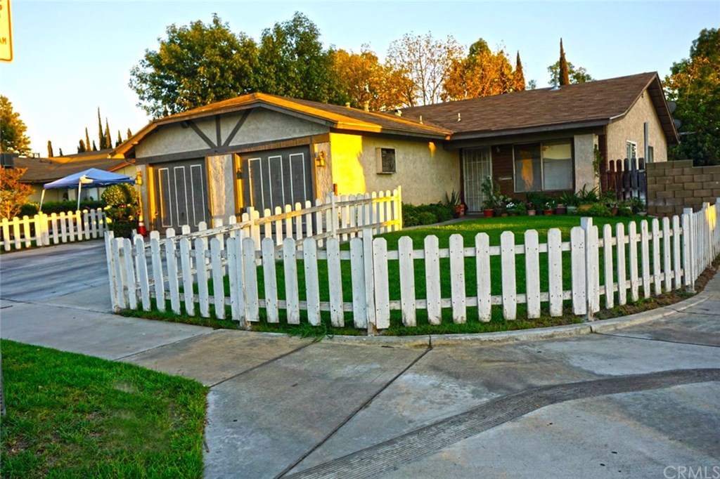 8186 Zinnia Place Riverside, CA 92503 - Photo 1 of 1 a front view of a house with a garden