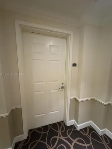 a kitchen with a refrigerator and a stove