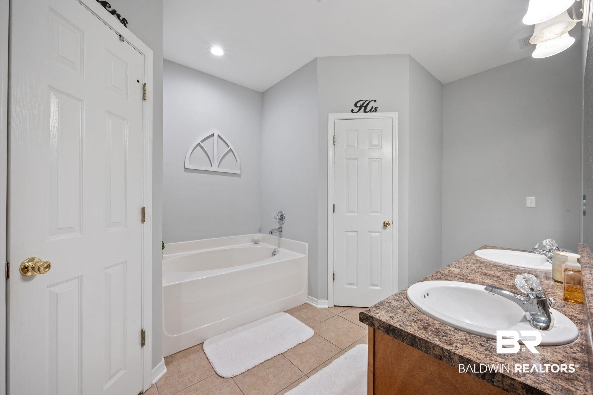 9539 Lakeview Road Bay Minette, AL 36507 - Photo 16 of 45 Bathroom featuring tile patterned floors, vanity, and a bath