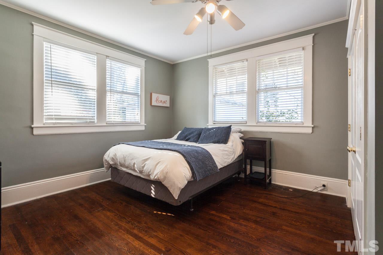 1907 Alexander Road Raleigh, NC 27608 - Photo 15 of 29 a spacious bedroom with a bed and a window