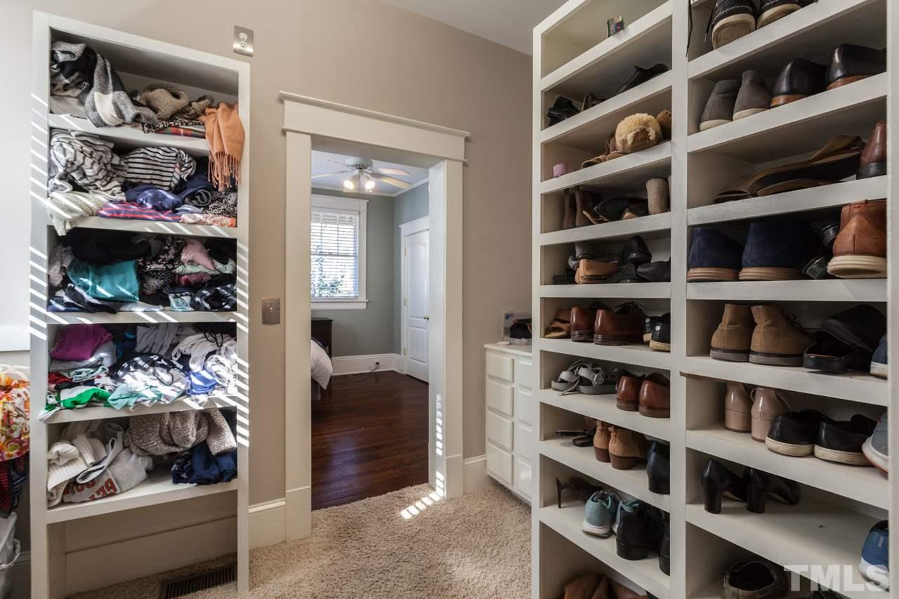 1907 Alexander Road Raleigh, NC 27608 - Photo 16 of 29 a view of walk in closet with clothes and shoes