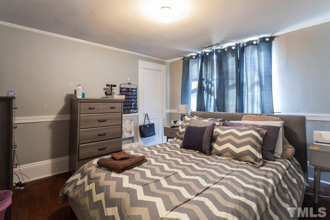 1907 Alexander Road Raleigh, NC 27608 - Photo 20 of 29 a bedroom with a bed and a dresser