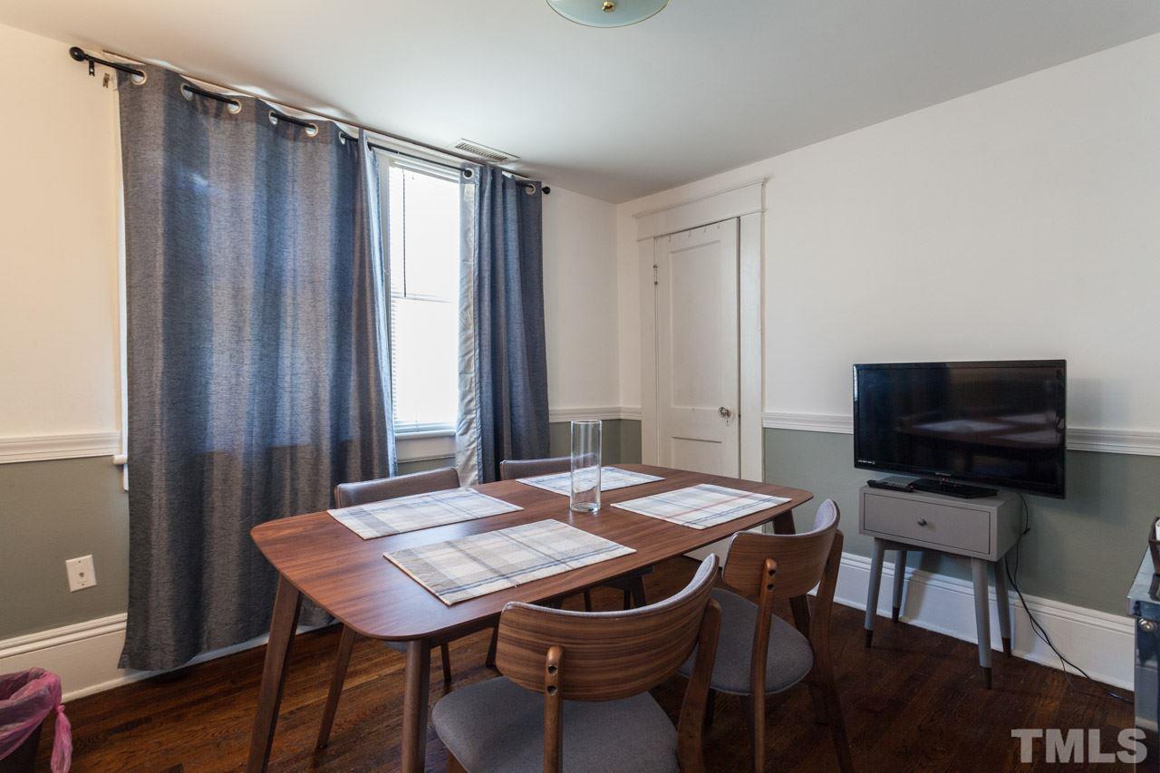 1907 Alexander Road Raleigh, NC 27608 - Photo 21 of 29 a view of a dining room with furniture