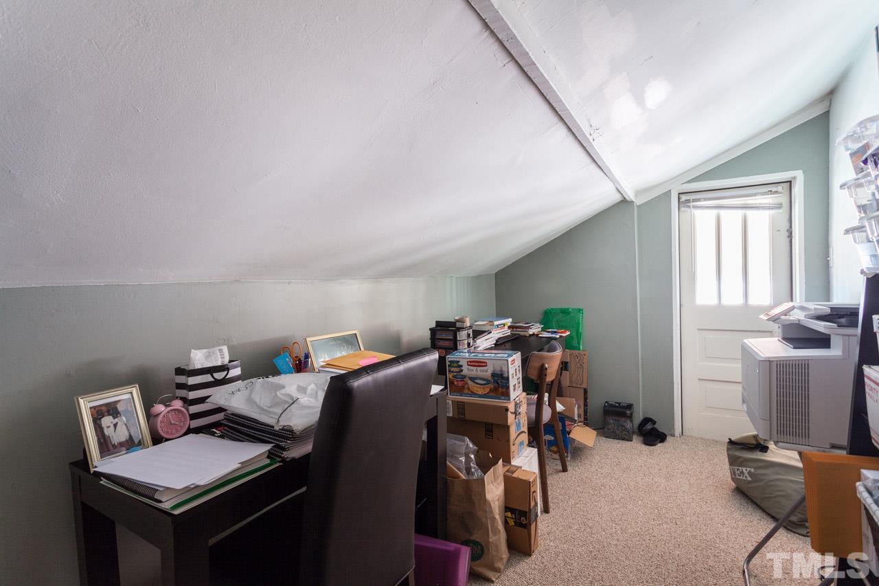 1907 Alexander Road Raleigh, NC 27608 - Photo 22 of 29 a bed room with furniture and a window