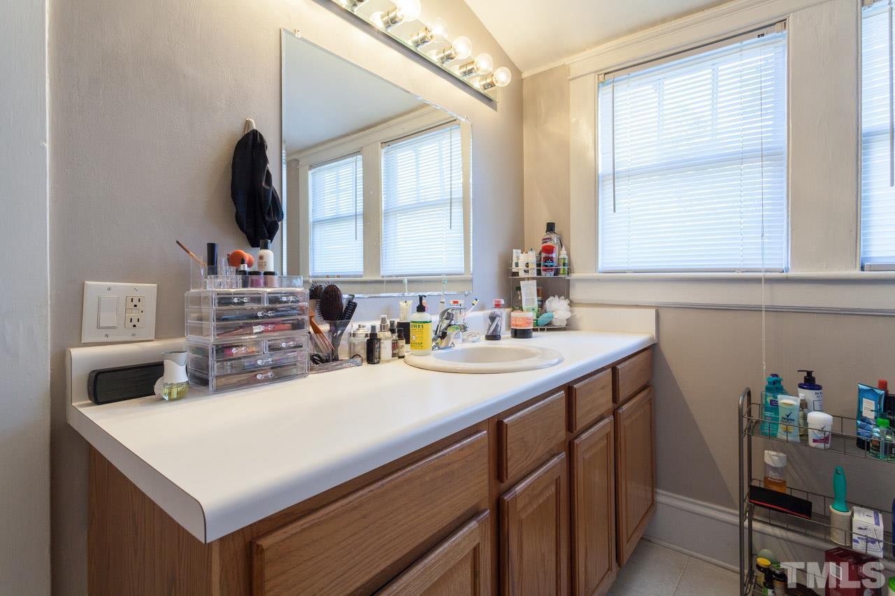 1907 Alexander Road Raleigh, NC 27608 - Photo 27 of 29 a kitchen with a sink cabinets and a window