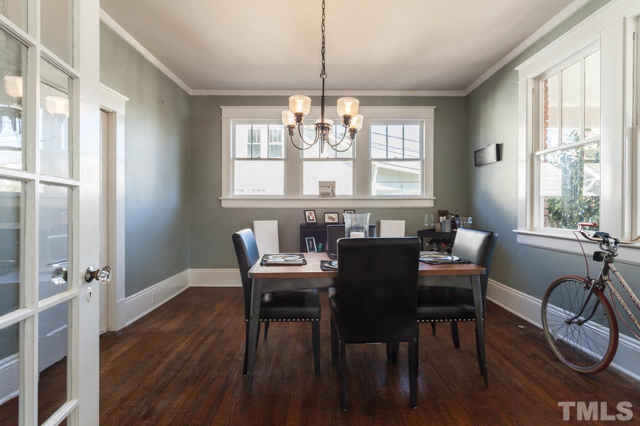 1907 Alexander Road Raleigh, NC 27608 - Photo 6 of 29 a view of a a dining room with furniture window and wooden floor
