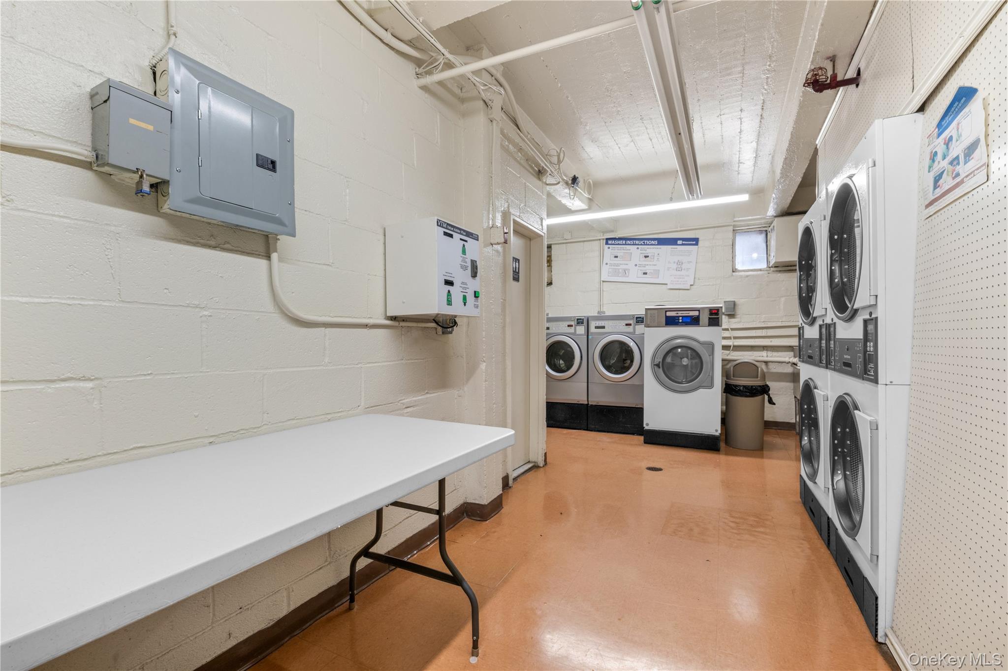 99-10 60th Avenue, Unit 3B Queens, NY 11368 - Photo 23 of 27 a utility room with dryer and washer