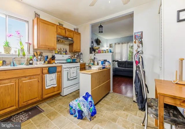 a view of a kitchen with appliances and a window