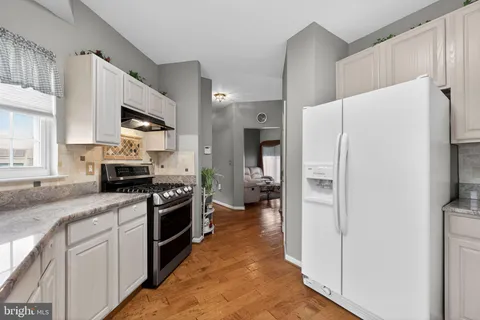 a kitchen with a refrigerator a sink and dishwasher