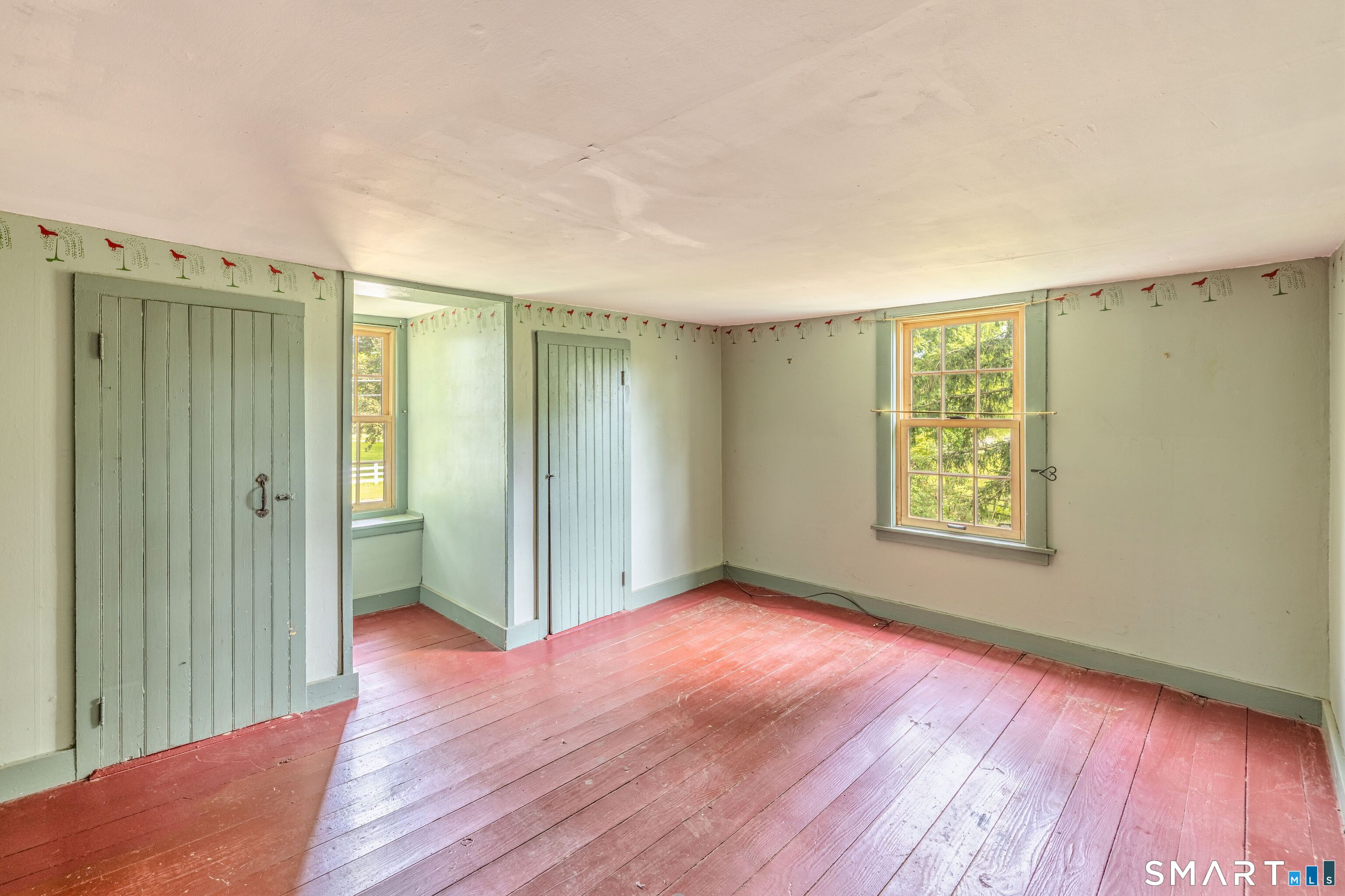 261 Hebron Road Bolton, CT 06043 - Photo 23 of 40 wooden floor in an empty room with a window