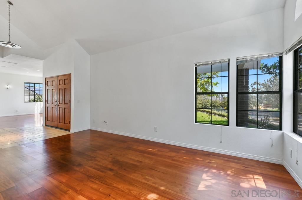 1861 Pacific Ranch Drive Encinitas, CA 92024 - Photo 9 of 36 a view of an empty room with a window and wooden floor