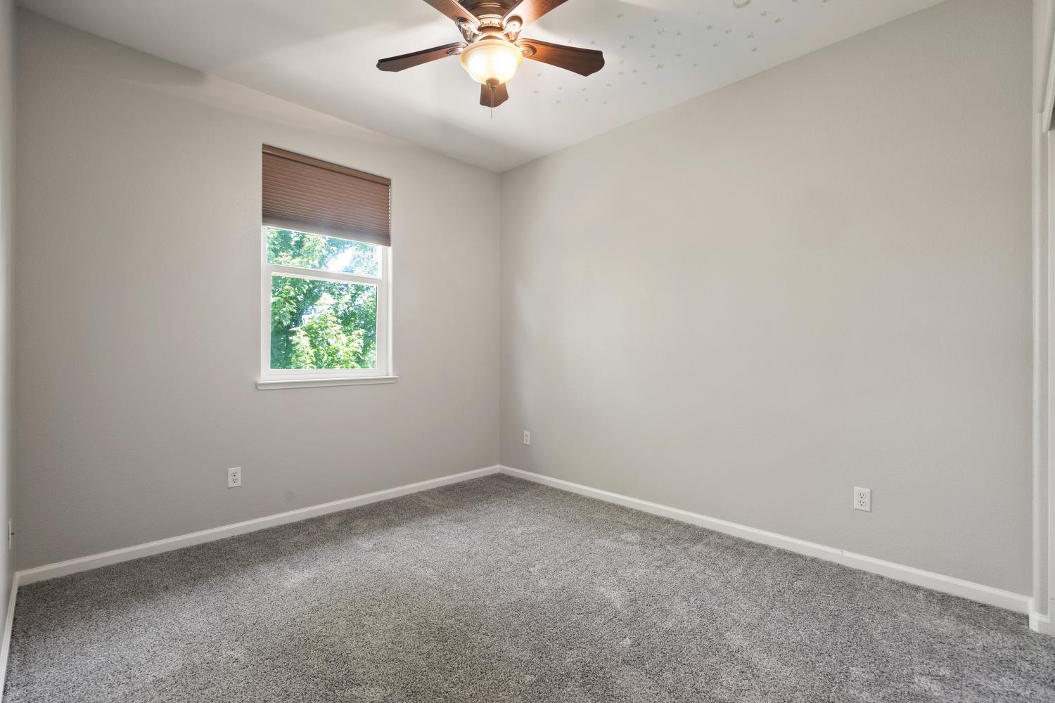1325 Coby Lane Orland, CA 95963 - Photo 15 of 36 an empty room with a window and a fan