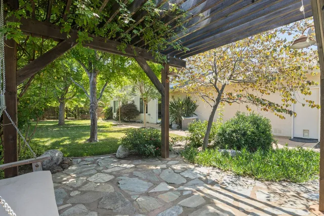 a backyard of a house with lots of green space