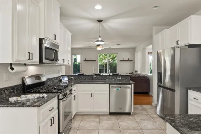 a kitchen with a sink stove and refrigerator
