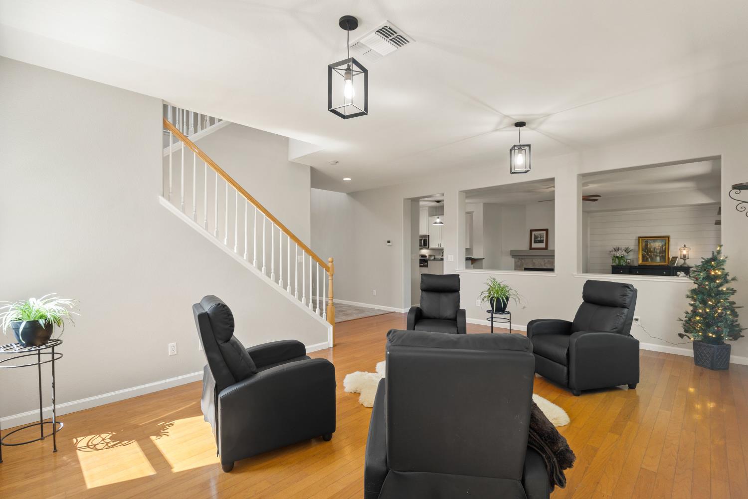 1325 Coby Lane Orland, CA 95963 - Photo 4 of 36 a living room with furniture or wooden floor and a chandelier