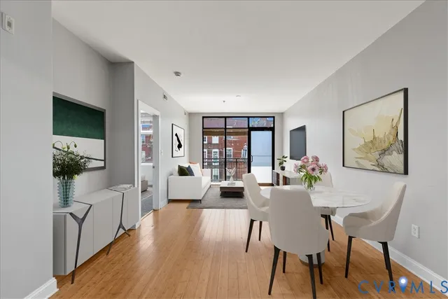 a view of a dining room with furniture window and wooden floor