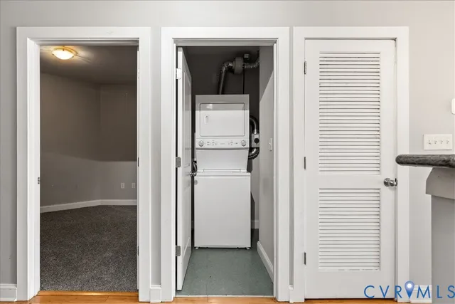 a view of a hallway with a white cabinet