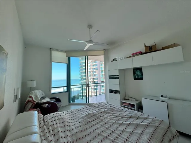 a bedroom with a bed and a couch