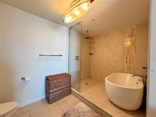 a bathroom with a bathtub and shower