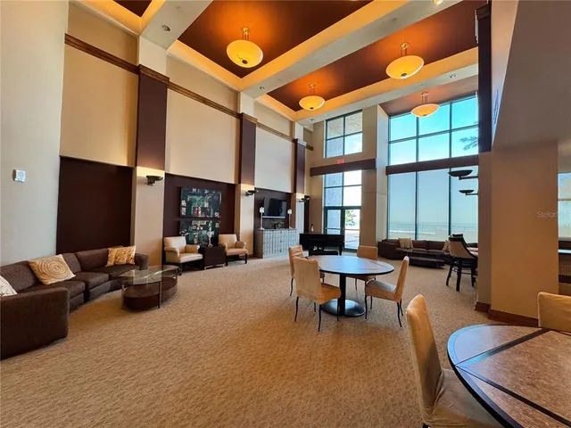 a large kitchen with stainless steel appliances a sink and a stove