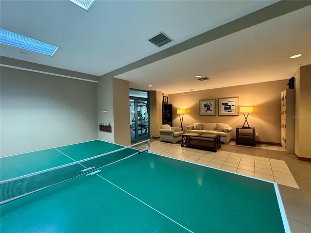 a view of a swimming pool with outdoor seating and yard