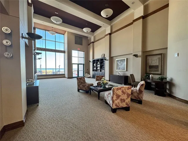 a view of a living room with a table and a potted plants