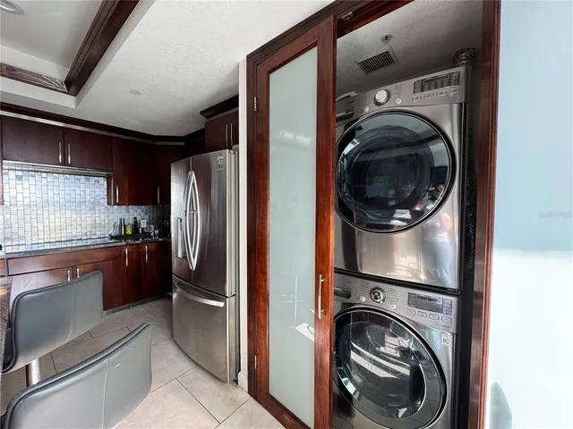 a view of a kitchen with washer and dryer