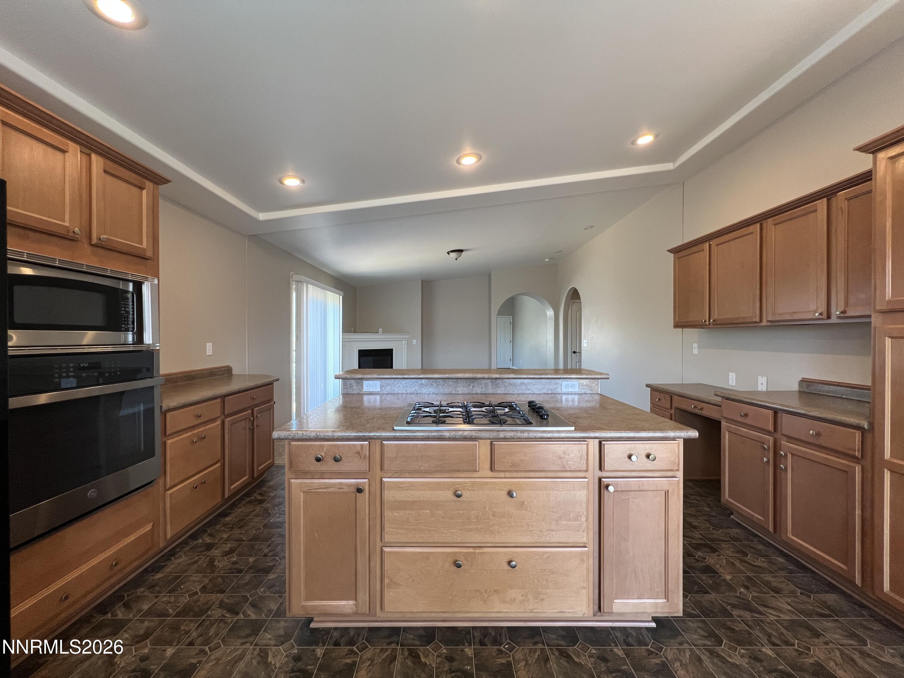 18406 Teddy Bear Court Reno, NV 89508 - Photo 8 of 44 a kitchen with stainless steel appliances granite countertop a stove a sink and a microwave
