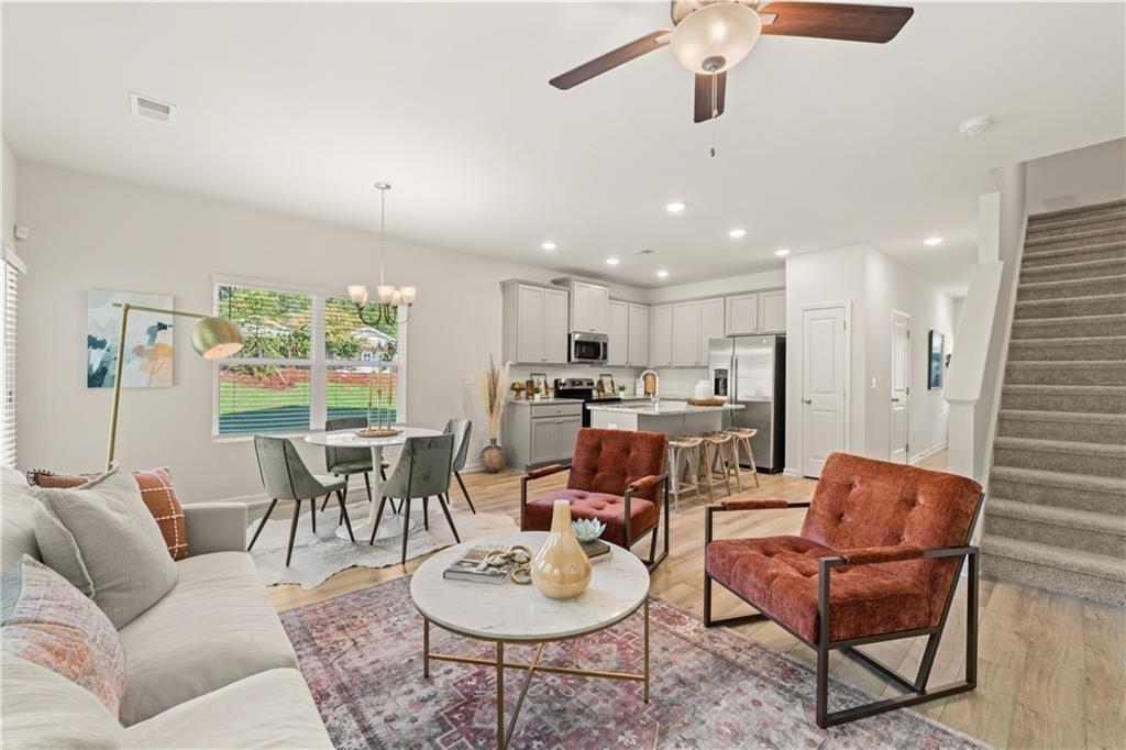 539 Buxton Road Hoschton, GA 30548 - Photo 4 of 13 a living room with furniture kitchen view and a window