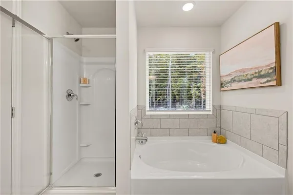 a white bath tub sitting next to a window