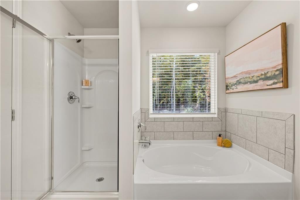 539 Buxton Road Hoschton, GA 30548 - Photo 8 of 13 a white bath tub sitting next to a window