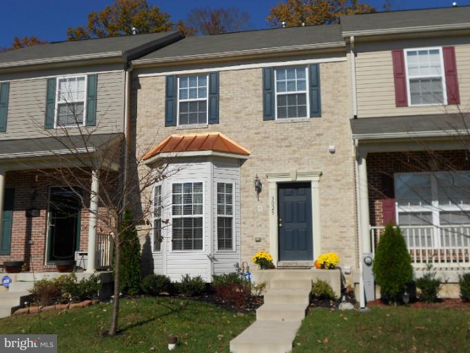 3025 Raking Leaf Drive Abingdon, MD 21009 - Photo 1 of 26 front view of a brick house with a yard