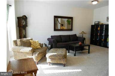 3025 Raking Leaf Drive Abingdon, MD 21009 - Photo 2 of 26 a living room with furniture and a lamp