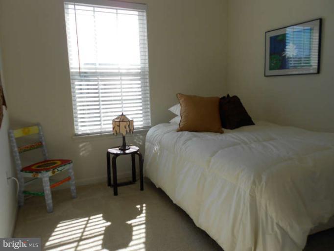 3025 Raking Leaf Drive Abingdon, MD 21009 - Photo 12 of 26 a bedroom with a bed and a window