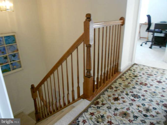 3025 Raking Leaf Drive Abingdon, MD 21009 - Photo 15 of 26 a view of a hallway with wooden floor and staircase