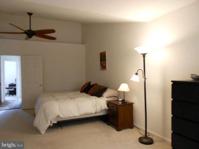 3025 Raking Leaf Drive Abingdon, MD 21009 - Photo 16 of 26 a bedroom with a bed and a night stand