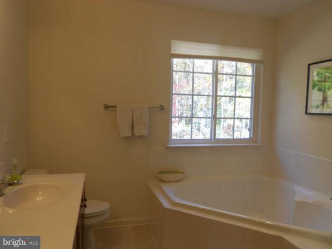 3025 Raking Leaf Drive Abingdon, MD 21009 - Photo 19 of 26 a bath room with a toilet and a bath tub
