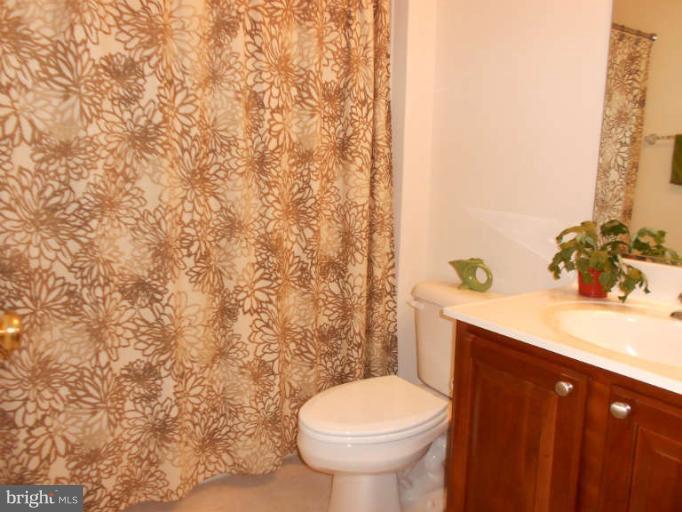 3025 Raking Leaf Drive Abingdon, MD 21009 - Photo 25 of 26 a bathroom with a sink and a toilet