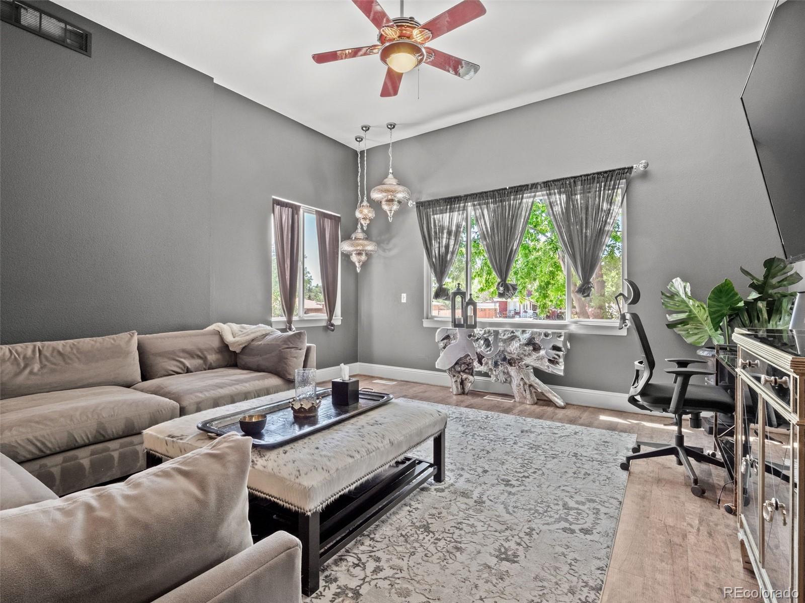 6595 West 46th Place Wheat Ridge, CO 80033 - Photo 10 of 48 a living room with furniture and a large window