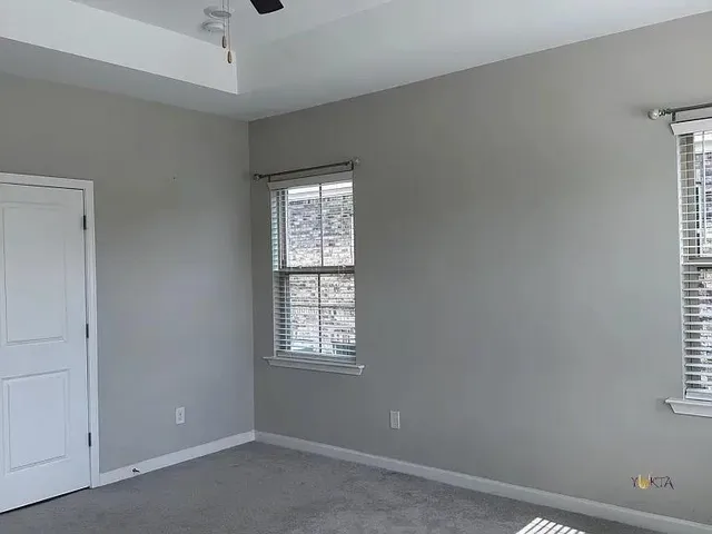 an empty room with windows