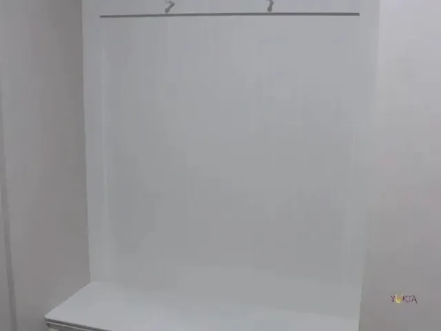 an aerial view of a house with a couple of chairs