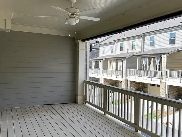 a view of a balcony with wooden floor