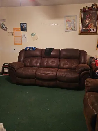 a kitchen with refrigerator and cabinets
