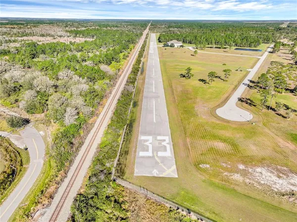 a view of a swimming pool and an outdoor space