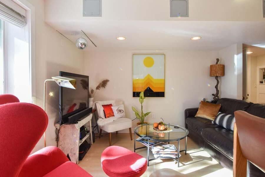 16 Thistlemore Road Provincetown, MA 02657 - Photo 14 of 27 a living room with furniture and a flat screen tv