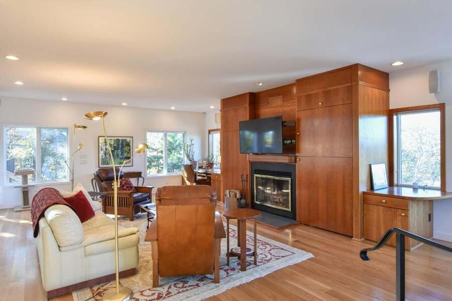 16 Thistlemore Road Provincetown, MA 02657 - Photo 20 of 27 a living room with furniture a fireplace and a flat screen tv