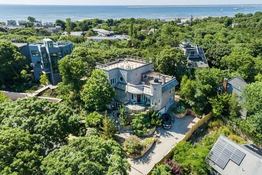 16 Thistlemore Road Provincetown, MA 02657 - Photo 2 of 27 an aerial view of a house with a yard and outdoor seating